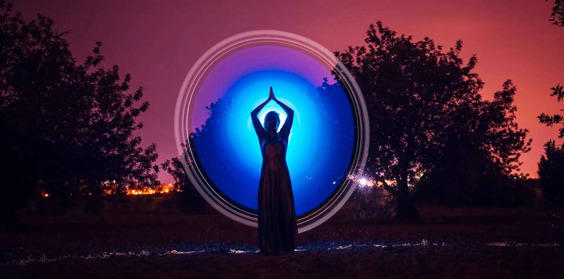 A radiant human silhouette with chakra points glowing