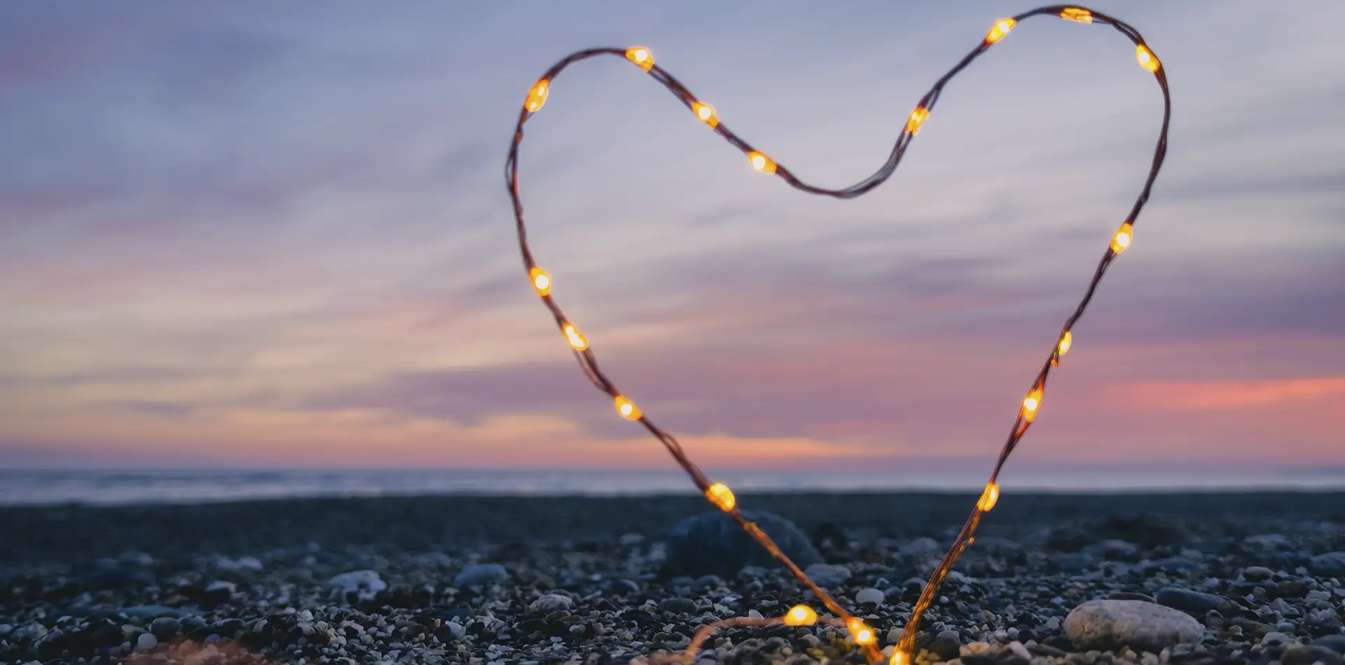 A serene, symbolic image of a glowing heart-shaped light