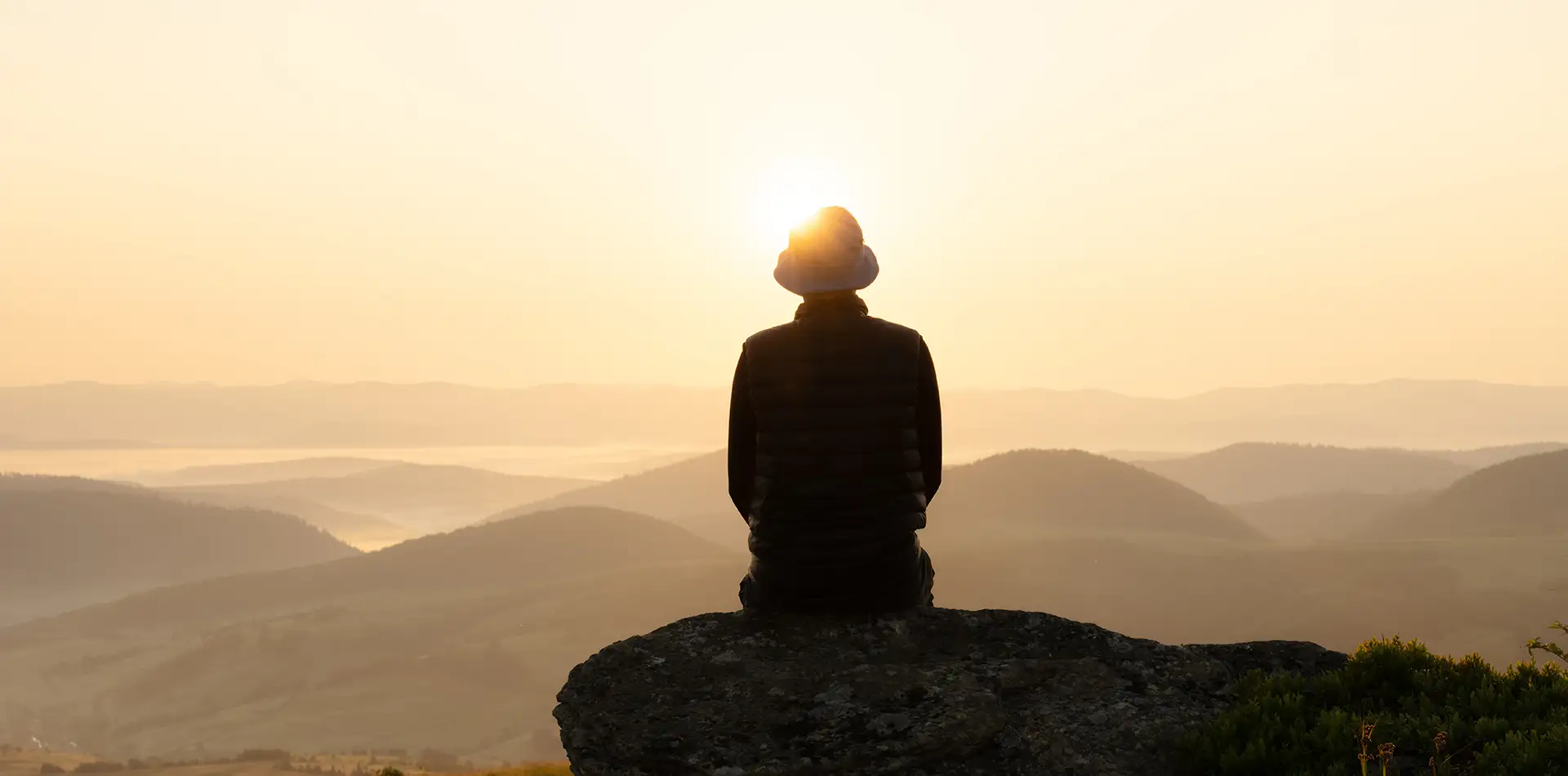 Person reflecting in nature while making personal spiritual decisions