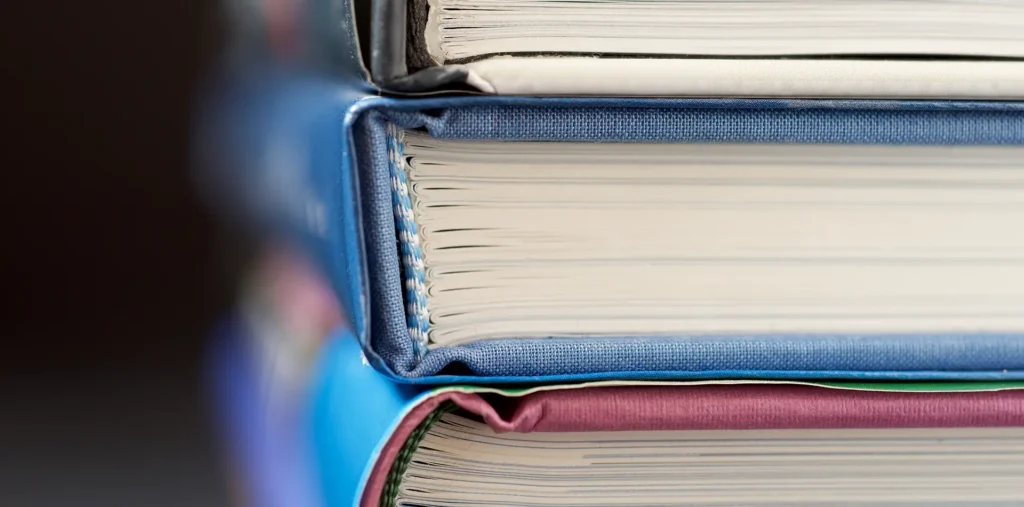 Three spiritual books forming the One Love Trilogy against a cosmic background