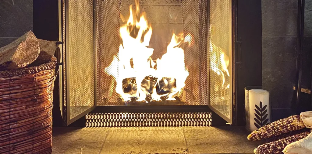 Warm winter scene with fireplace and lights symbolizing love and peace