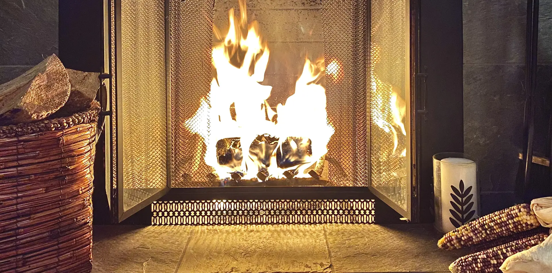 Warm winter scene with fireplace and lights symbolizing love and peace