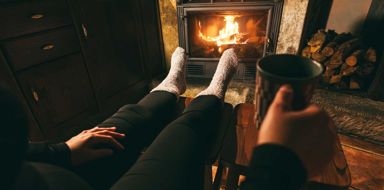 A contemplative moment by the fire symbolizing modern spirituality, inner guidance, and reflection