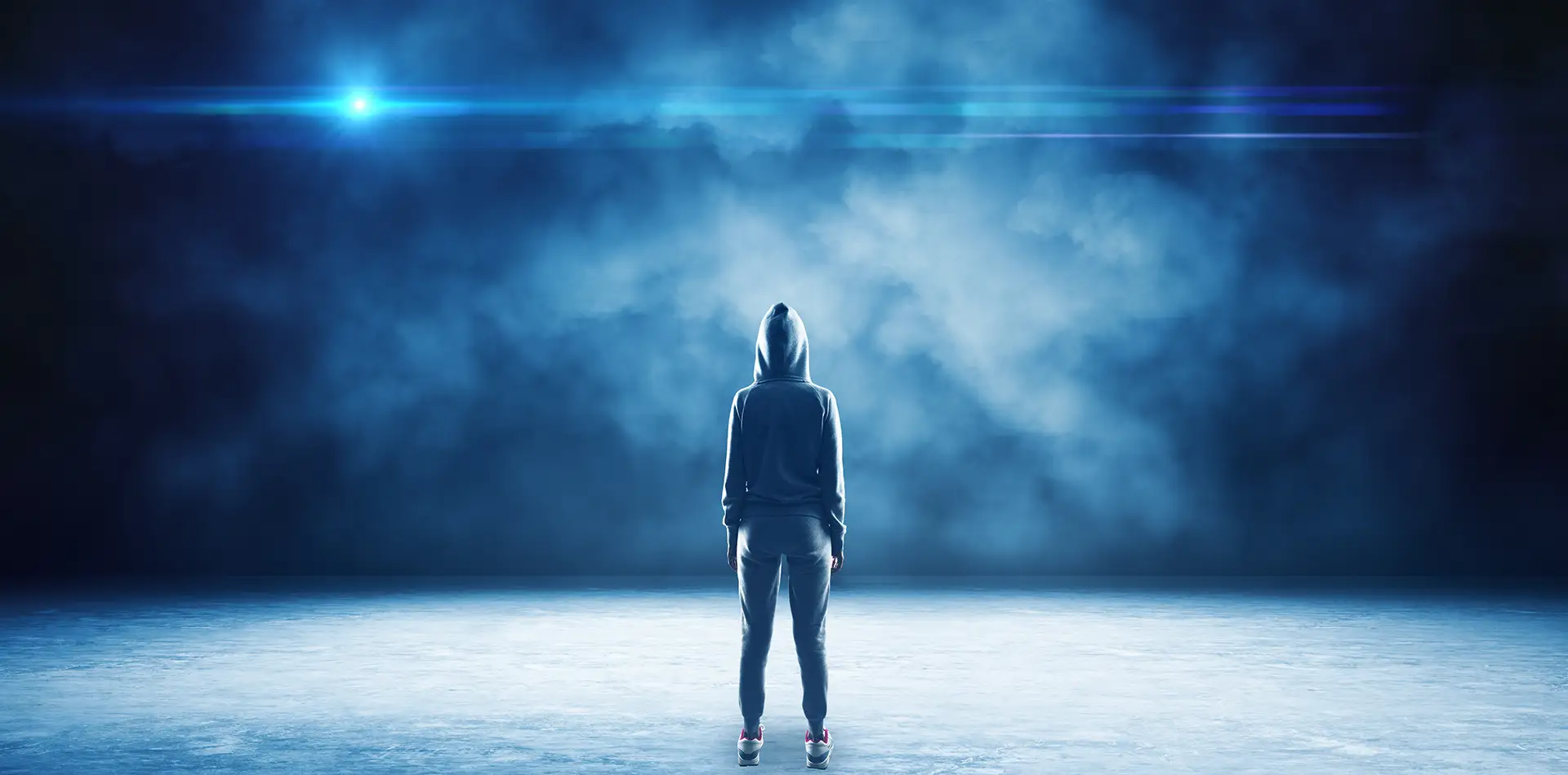 A glowing, transparent figure walks through a vibrant, colorful world that looks like a lucid dream.