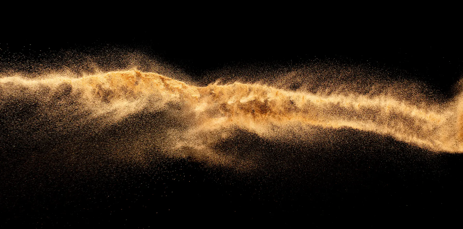 Golden light waves flow through a dark space, showing how energy connects everything in the universe.