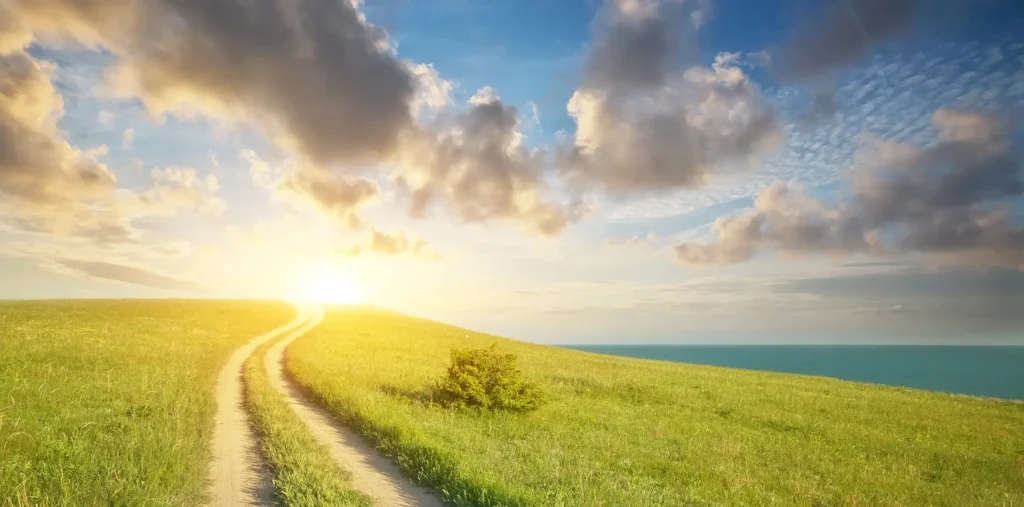 Mountain peak with a golden horizon, capturing the feeling of total freedom and joy.