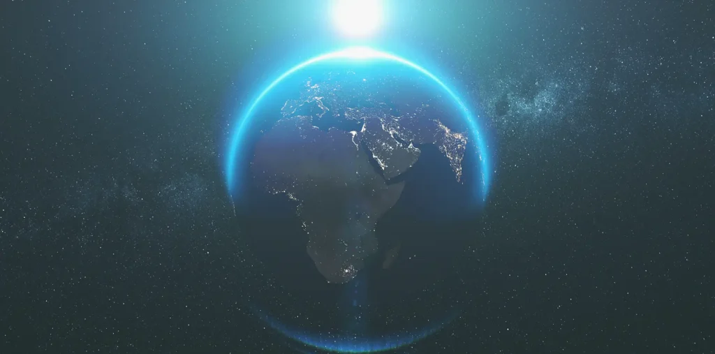 Earth seen from space with a glowing blue web of light wrapped around it, showing how energy connects every nation and person.