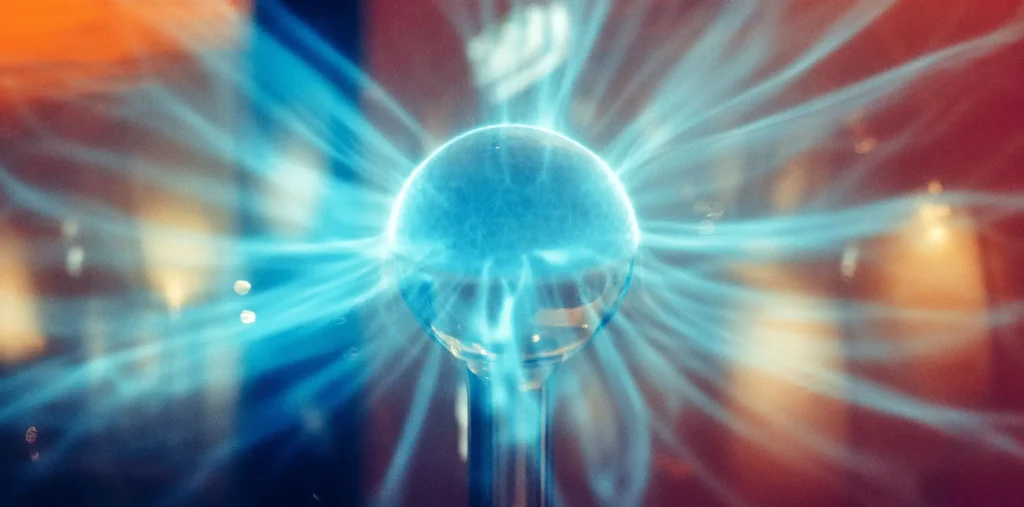 An artistic visualization of human silhouettes connected by vibrant, glowing energy threads, illustrating our collective unity.