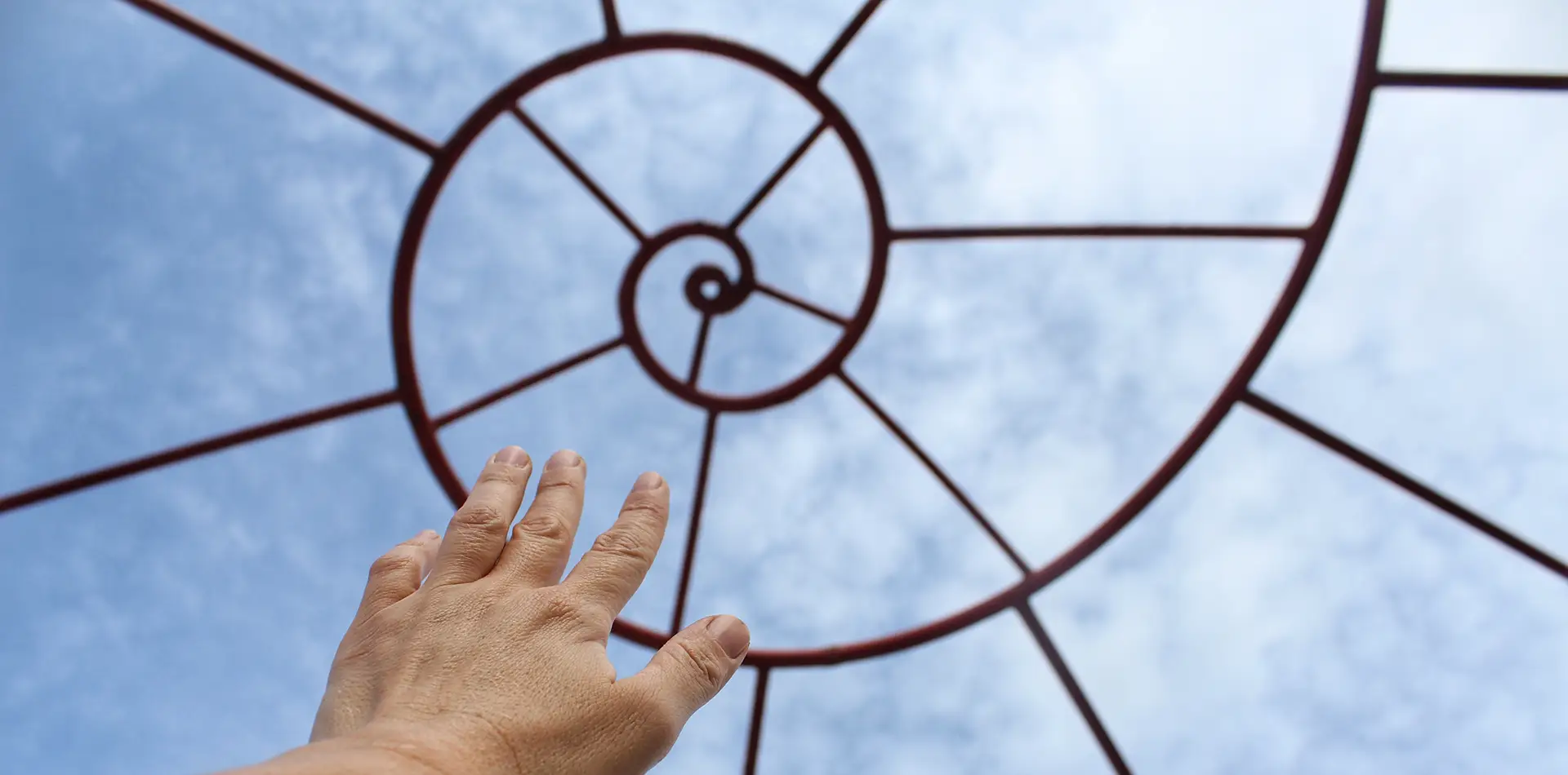 Golden Fibonacci spiral representing sacred geometry, consciousness, and the mathematical foundation of the Star of Light philosophy