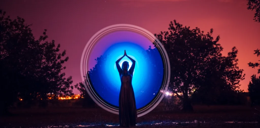 Glowing human silhouette connected to universal energy and inner light