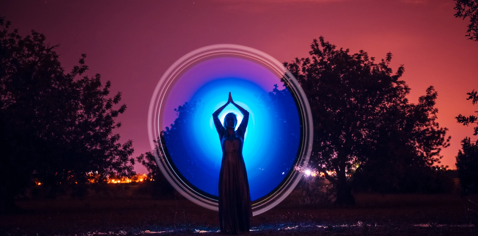 Glowing human silhouette connected to universal energy and inner light