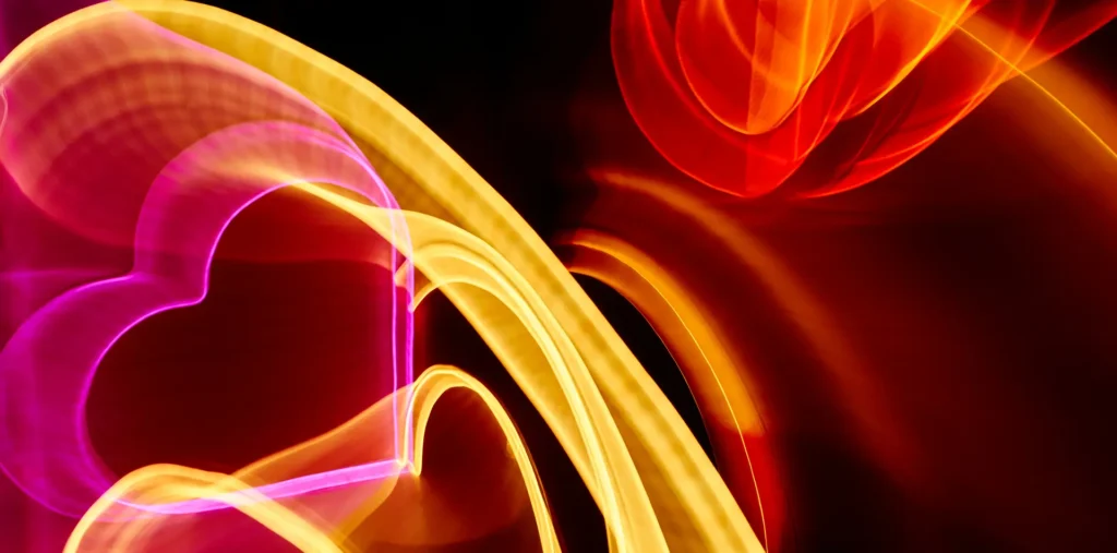 Glowing heart surrounded by a toroidal energy field and sacred geometry representing divine protection and creative power