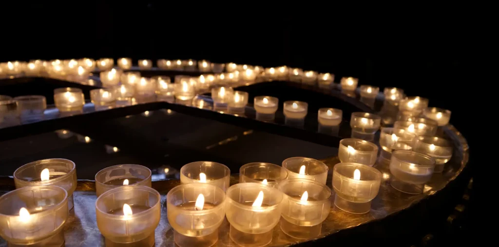 Candlelit altar with crystals and bowls set for a full moon ritual ceremony