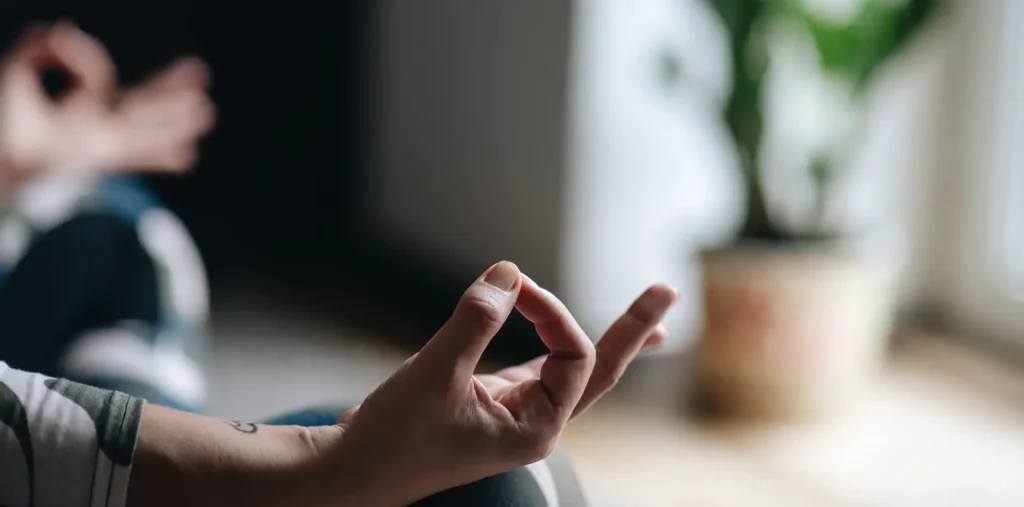 A person in a calm meditative state representing the connection between spiritual well-being and heart health