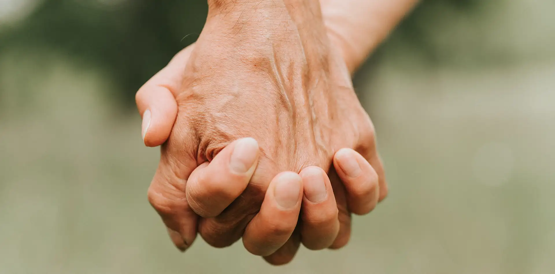 Two hands reaching to help each other, symbolizing service and cooperation in daily life