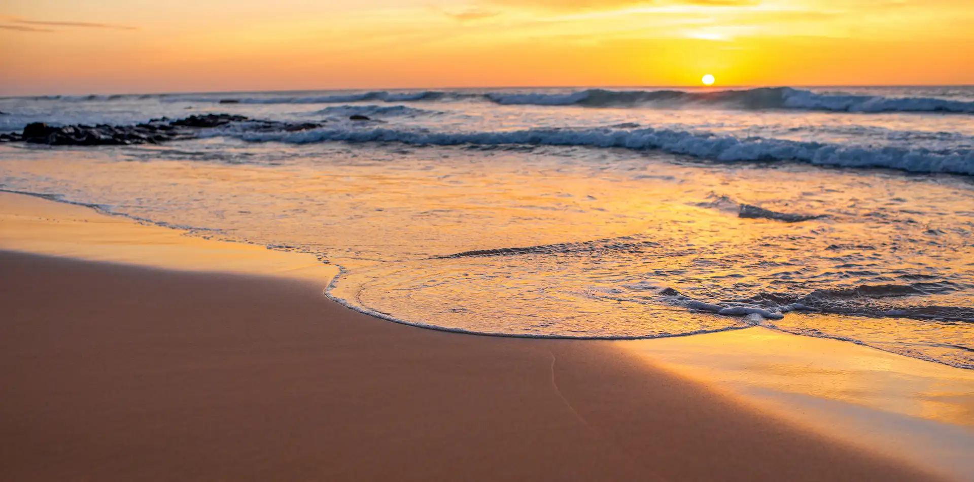 Calm sunrise over a tropical bay representing spirituality through simplicity