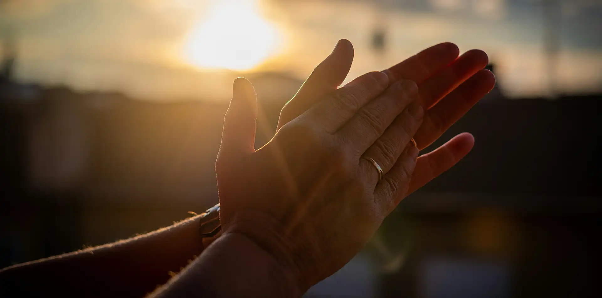 A person offering open hands to another, symbolizing service and giving with no expectation of return