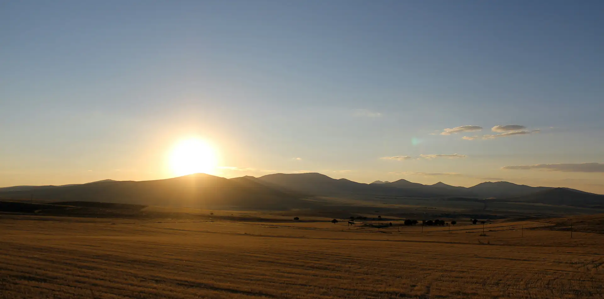 Golden sunrise over an open path at dawn, evoking freedom, wisdom, and gratitude for another day