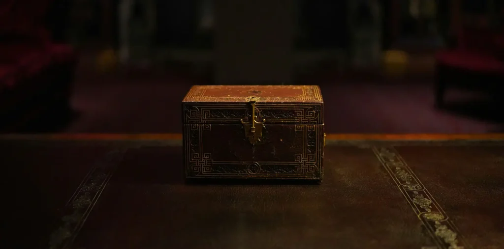An ornate golden chest radiating warm light in a dark, peaceful sacred space
