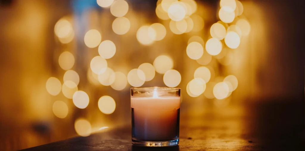 Hourglass glowing in soft golden light, symbolizing gratitude for time, simplicity, and inner peace