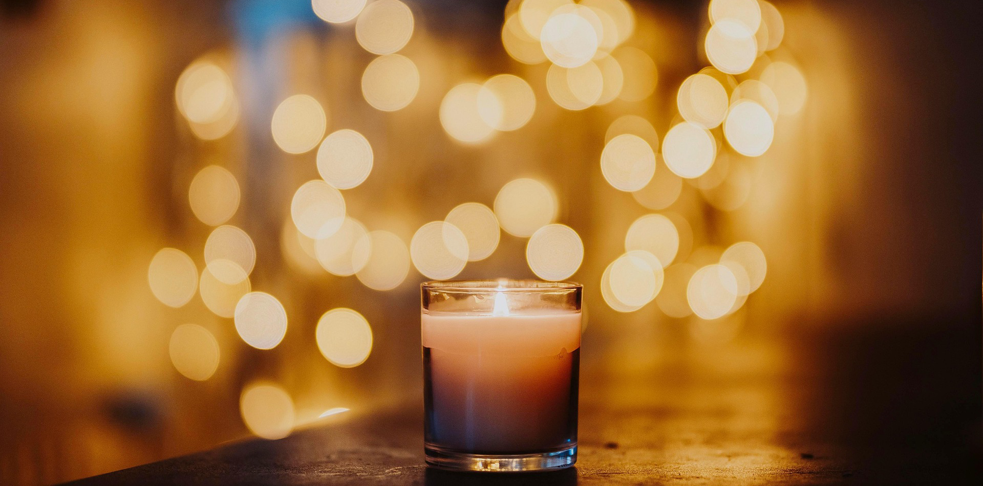 Hourglass glowing in soft golden light, symbolizing gratitude for time, simplicity, and inner peace