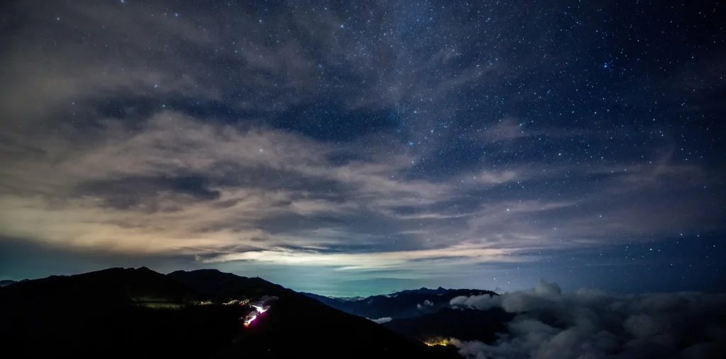 Calm starry night sky with soft glowing light symbolizing gratitude, peace, and quiet reflection